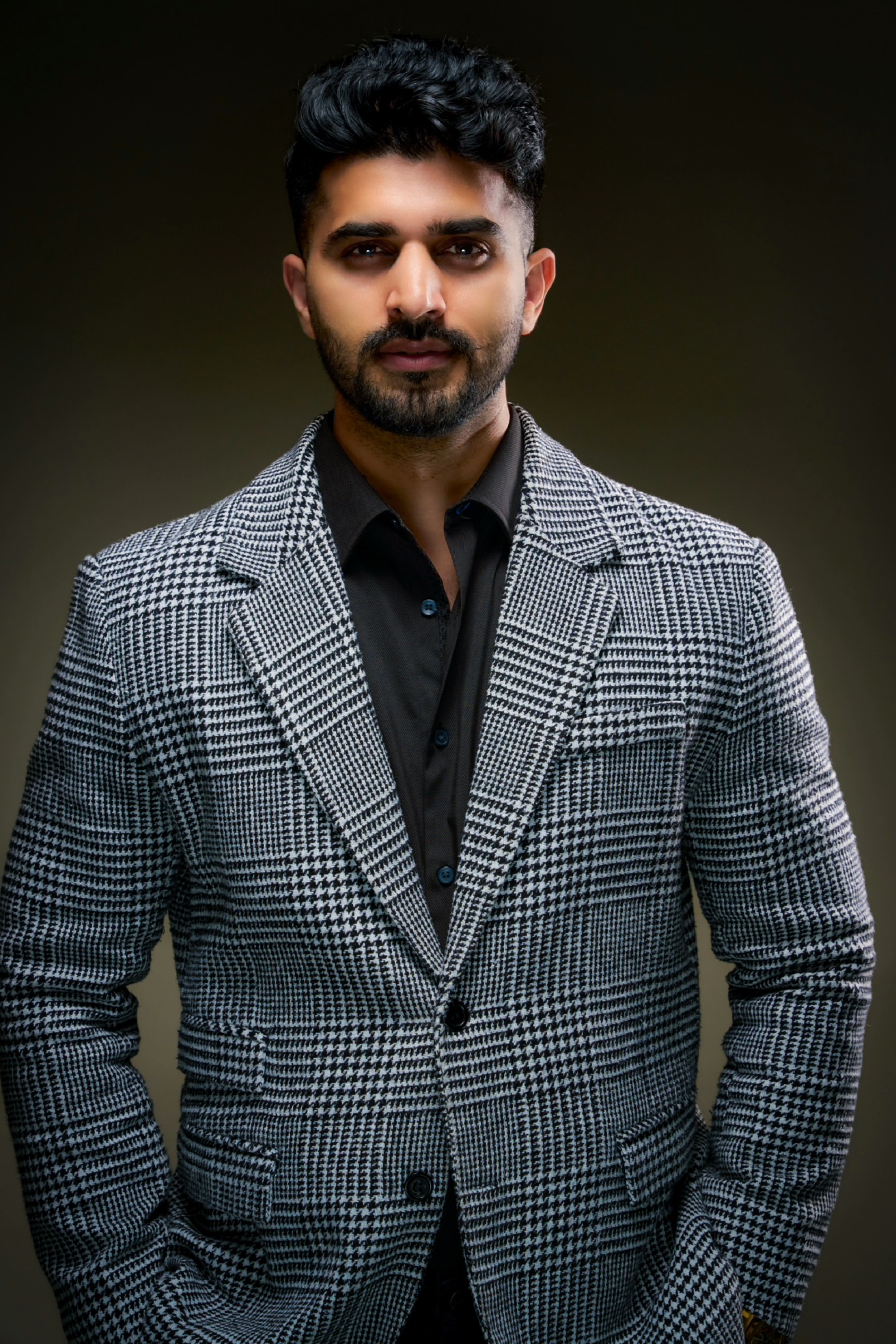 Aqeel outdoors by the lake with mountains—Beyond Desi hero image